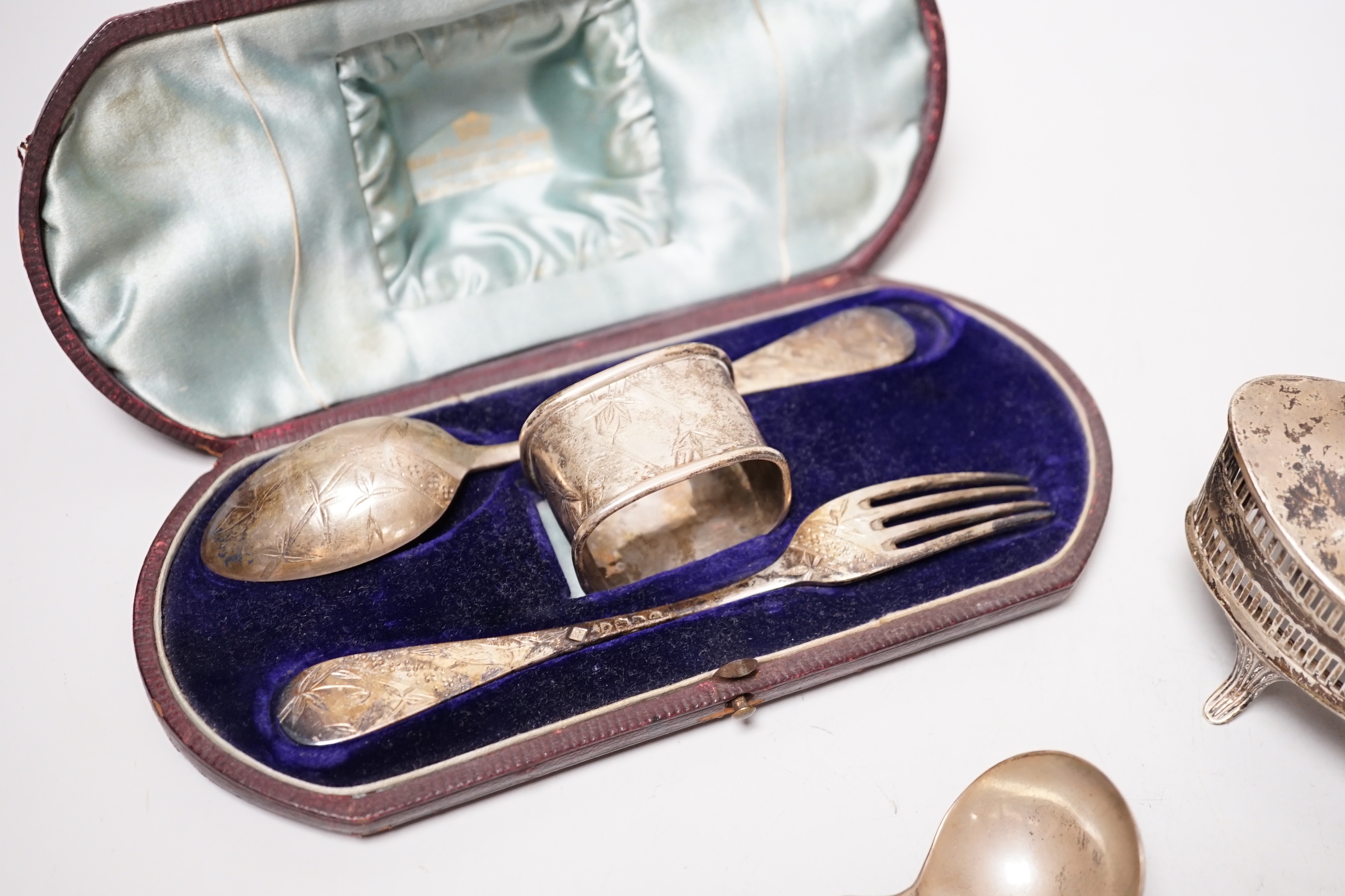 A cased Victorian silver christening trio, Martin, Hall & Co, London & Sheffield, 1881, a pair of William IV silver fiddle pattern sauce ladles, London, 1836 and a late silver mustard, lacking liner.